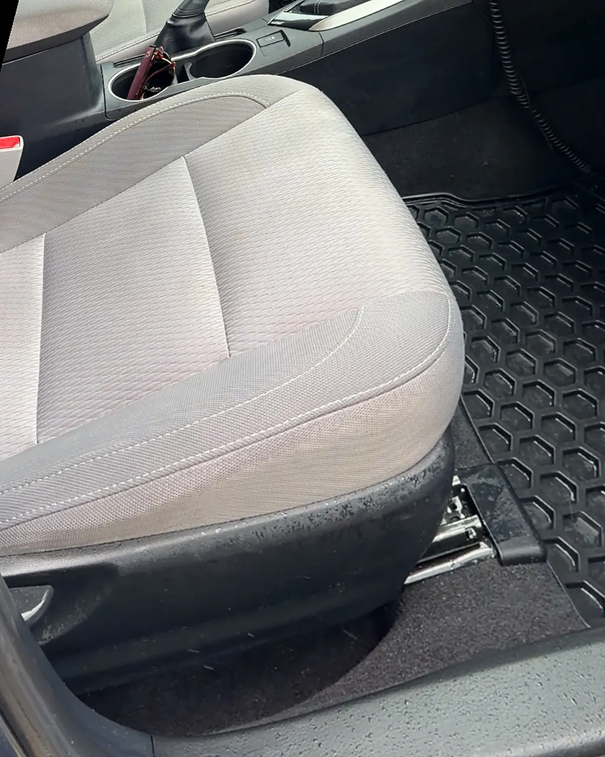 The same seat from the same position, the staining gone and the cloth an even grey