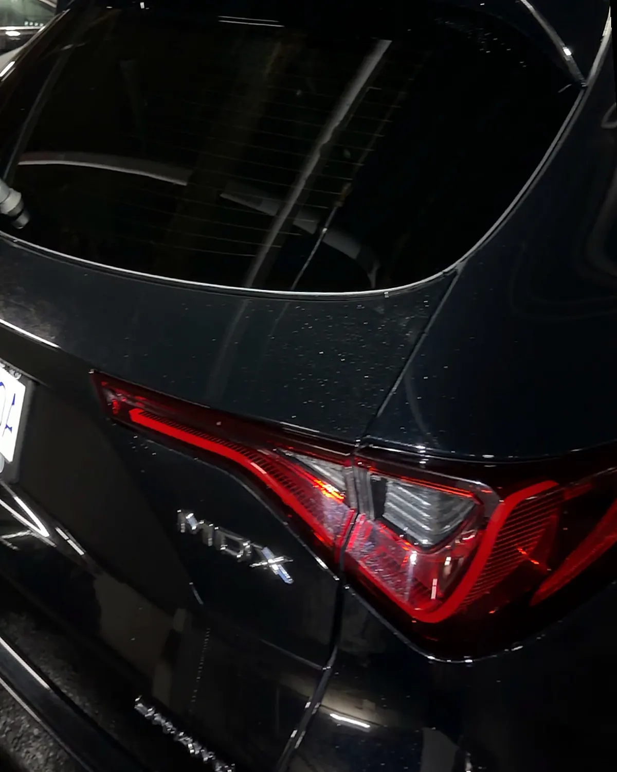 The same hatch and tail light from the same position, the paint clean and glossy